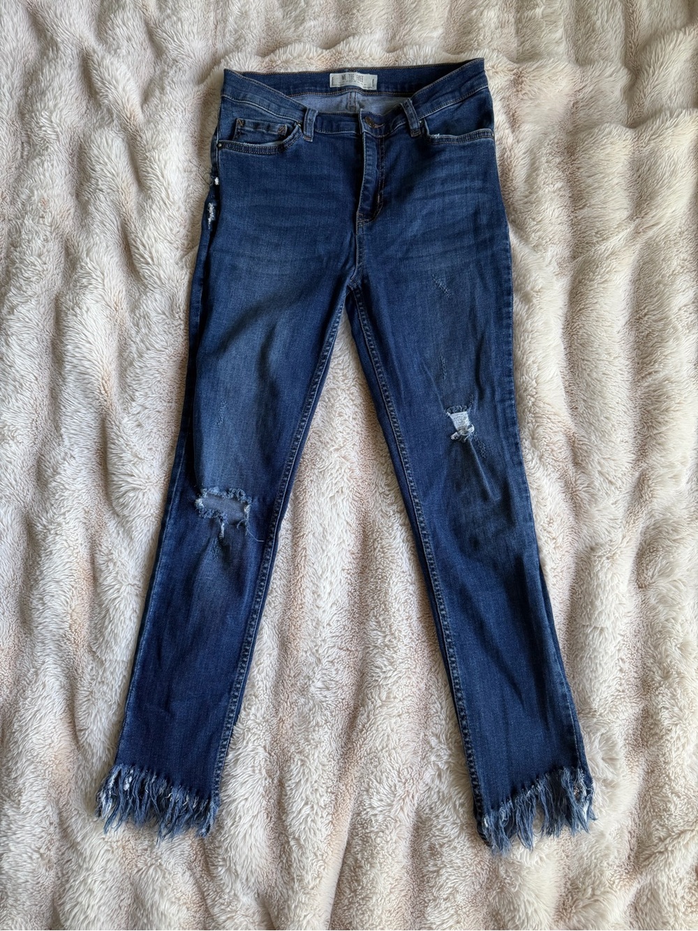 We The Free Indigo Skinny Jeans with Distressed Knees and Frayed Hem